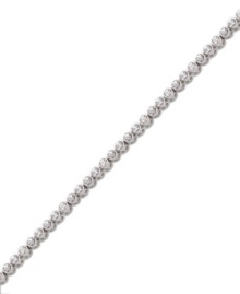 Add sheer elegance to your ensemble with a simple, sparkling bracelet. Swarovski's tennis-style bracelet features bezel-set round-cut crystals in silver tone mixed metal. Approximate length: 7 inches.