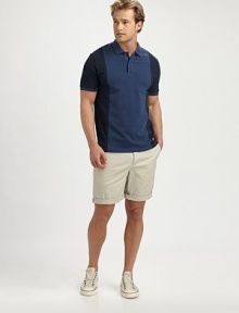 A touch of stretch adds to the comfort of this spirited polo in bold colorblocked cotton.Polo collarTwo-button placketShort banded sleevesStraight hem with side slits97% cotton/3% spandexMachine washImported