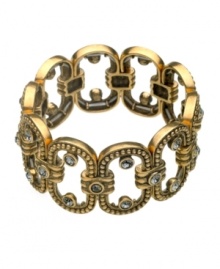 Regal and Renaissance inspired. Based on oval shapes with an ornate circular motif and clear crystal accents, T Tahari's gold tone mixed metal bracelet features a stretch design. Approximate diameter: 2-1/4 inches.