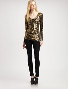 Shimmer away in this fitted metallic top with long sleeves and an asymmetrical cowlneck. Asymmetrical cowlneckLong sleeves95% polyester/5% spandexDry cleanMade in USA of imported fabricModel shown is 5'9½ (176cm) wearing US size Small.