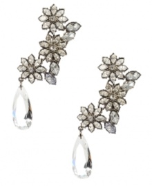 Garden state. A beautiful trio of blooms are complemented by a sparkling teardrop-shaped crystal on these delightful drop earrings from Betsey Johnson. Crafted in silver tone mixed metal, they'll add springtime style to your look no matter what the season. Approximate drop: 3-1/10 inches.