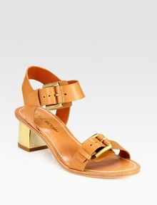 Lacquered heel topped with wide leather buckle straps. Lacquered heel, 2 (50mm)Leather upperAdjustable strapsLeather lining and solePadded insoleImportedOUR FIT MODEL RECOMMENDS ordering one half size down as this style runs large. 