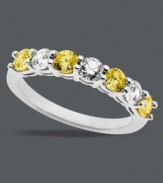 Citrus bliss. A splash of round-cut white (9/10 ct. t.w.) mixed with yellow Swarovski zirconias (1-1/4 ct. t.w.) make Arabella's stunning 7-stone ring a total stand out. Crafted in sterling silver. Size 7.