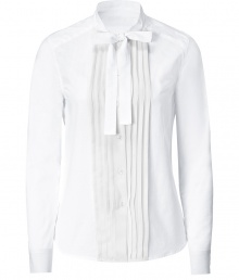 Elegant white blouse of fine cotton - Tuxedo styling with pleated front and tied, fitted collar - Long, slim sleeves with buttoned cuffs - Style classically with pencil skirt, suit pants and heels or mix it up with a thin leather jacket and skinny jeans