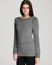 This charming French Connection crewneck sweater boasts the season's minimalist design sensibility with the distinct flourish of knitted baubles at the shoulders.