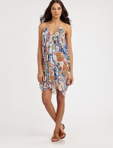 Draped in luxury, an abstract-lotus print coverup with draped details for an ultra-flattering look. Round neckSleevelessFlattering gathered detailsPull-on style95% modal/5% spandexHand washMade in USA of Italian fabric