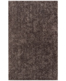 Add pure, shimmering grey texture to any modern room with the Metallic area rug from Dalyn. Hand-tufted of soft polyester, this high-luster shag area rug puts comfort and fun back in floor decor.