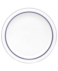 Named for a trendy Copenhagen neighborhood but designed with timeless style, the Christianshavn Blue bread and butter plate features a double band of navy in pristine white porcelain. From Dansk.