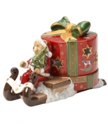 Teddy carries a brilliant surprise on the back of his sleigh in this beautifully crafted candle holder from Villeroy & Boch. Light shines through pierced stars in a present wrapped in charming vintage style.