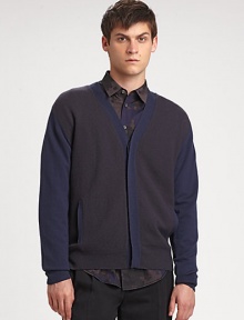 The classic cardigan with a decidedly right-now look. Concealed button frontSlash pocketsAbout 29 from shoulder to hemMerino woolDry cleanImported of Italian fabric