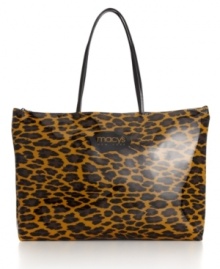 A golden Macy's New York logo amplifies the warm hues of always-chic leopard print on this glossy tote.