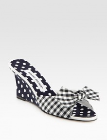 Vivid polka dots add charm to this mule wedge mixed with a classic gingham print and fine leather trim. Self-covered wedge, 3 (75mm)Fabric and grosgrain ribbon upper with leather trimGrosgrain liningLeather solePadded insoleMade in Italy