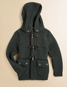 A rustic hip-length layer in a chunky waffle knit with a versatile detachable hood and preppy toggle details.Detachable button hoodRibbed stand collarLong sleeves with ribbed cuffsElbow patch detailFront toggle closureFront patch button pocketsRibbed hem80% wool/20% nylonHand washMade in Italy