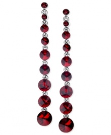 Look radiant in red with this pair of linear earrings from GUESS. Crafted from hematite-tone mixed metal, the earrings dazzle with glass crystal stones. Item comes packaged in a signature GUESS Gift Box. Approximate drop: 4 inches.