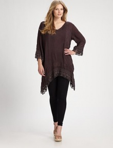 You will not want to take off this flowing, flattering tunic featuring exquisite embroidered details. V-necklineLong sleevesDropped shouldersEmbroidered trimHi-lo hemAbout 35 from shoulder to hemRayonMachine washImported