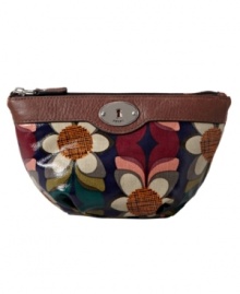 Fossil's dome cosmetic case comes in fun color combos, in easy-to-clean coated canvas.