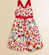 In cotton sateen with a painterly floral pattern and adorable grosgrain trim, this cross-back party dress is a must-have for stylish little ones.Spaghetti straps, cross at backGathered necklineConcealed back-zip closureGathered waist with grosgrain trimHem falls above kneeCottonDry cleanMade in USA of Italian fabrics