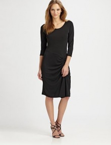 A refreshing take on the LBD, this elegant design features sporty raglan sleeves, an asymmetrical waistline and flattering side ruching.Round necklineRaglan sleevesRuched side detailAbout 37 from shoulder to hem70% rayon/24% polyester/6% spandexDry cleanImported Model shown is 5'10½ (179cm) wearing US size 4. 