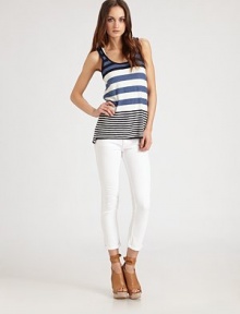 Sporty cotton scoopneck in allover bold stripes has an on-trend racerback and hits below the hips. ScoopneckSleevelessRacerbackLonger length hits below the hipsCottonHand washImported