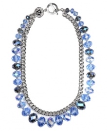 Add a splash of color this season. AK Anne Klein's double strand necklace incorporates shimmery blue-colored glass beads and chain detail secured by a toggle clasp. Crafted in mixed metal with imitation rhodium-plating. Approximate length: 16 inches + 2-inch extender.