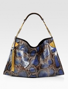 Elegantly redefined, this python shoulder bag embodies true '70's glamour. Hand colored by expert craftsmen, each version of this bag is unique.Periwinkle pythonAntique gold hardwareChain shoulder strap with leather detailMagnet snap closure on topInside zip, cell phone, and PDA pocketsNatural cotton linen liningMedium size: 17.3L x 1.4W x 11.4HMade in Italy