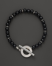 Black chalcedony gives a bold, classic look to a toggle bracelet from Gucci.