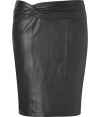 Sleek leather separates are trend-favorite must this season, and Steffen Schrauts twisted waist lambskin skirt is a super feminine choice - Hidden back zip, kick pleat, form-fitting - Pair with modern cashmere and flats for work-week sophistication