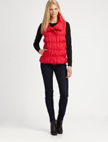 A puffy nylon vest with a decidedly feminine silhouette and convenient slash pockets.Stand collarSleevelessConcealed front closureSlash pocketsAbout 26 from shoulder to hemBody: nylonFill: down feathers/other feathersDry cleanImportedSIZE & FIT Model shown is 5'10½ (179cm) wearing a US size Small. 