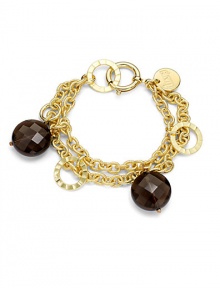 THE LOOKA graceful double chain with textured linksFaceted smoky quartz beads alternate with flat, polished open discsOversized spring ring claspTHE FITLength, about 7½THE MATERIALSmoky quartz18k gold platingORIGINMade in Italy