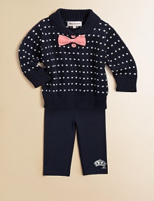 A comfy cotton knit is adorned with decorative bow and button details and paired with matching leggings for cozy, cute style.Folded collarLong sleevesPullover styleRibbed cuffs and hemElastic hemSweater: CottonLeggings: 94% cotton/6% spandexMachine washImported