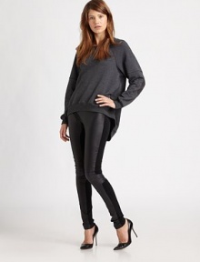 Soft, casual-cool staple modernized by dropped shoulders, contrast trim and a zipper-detailed hi-lo hem. RoundneckDropped shouldersLong sleeves with banded cuffsHi-lo hemBack zipper at hemBody: 35% rayon/33% polyester/27% cotton/5% LycraContrast: 48% rayon/47% polyester/5% LycraMachine washMade in USAModel shown is 5'10 (177cm) wearing US size Small.