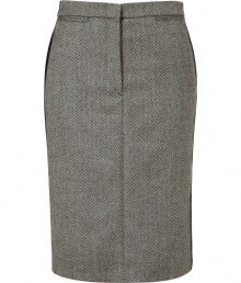 Luxurious skirt in a fine wool and cashmere blend - Features a classic herringbone pattern in black and ecru - Slim, narrow pencil cut with decorative side stripes and small welt pockets with button closure at back - Sophisticated look with a blazer, blouse and heels - Transitions effortlessly from office to evening