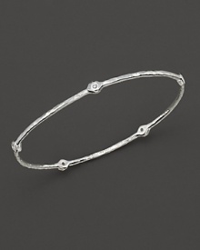 From the Silver collection, a five-diamond hammered bangle in sterling silver. Designed by Ippolita.