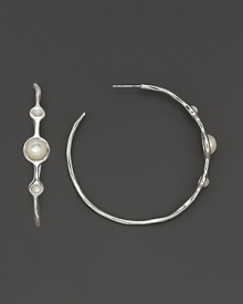 Three mother-of-pearl cabochons, set in sterling silver hoop earrings.