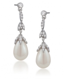 Fit for a princess. Carolee's elegant linear teardrop earrings convey a regal bearing. Adorned with glass pearls and sparkling glass accents, they're crafted in silver tone mixed metal. Approximate drop: 1-1/2 inches.