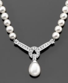 Elegant pearls (9mm) are heightened in beauty with the addition of sparkling round-cut diamonds (1/3 ct. t.w.) in this breathtaking necklace. Approximate length: 17 inches. Approximate drop: 1-1/4 inches.