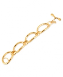 Well-connected. This bracelet from Robert Lee Morris is crafted from gold-tone mixed metal, and features oval links and a toggle closure. Approximate length: 7-1/2 inches.