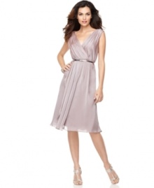 Jones New York's beautiful chiffon dress features an iridescent hue and a graceful, feminine silhouette. The removable metallic belt makes it easy to coordinate with sparkling, strappy shoes.