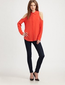 Downtown-cool cutout shoulders and a hi-low hem update this lengthy silk staple. Point collarCutout shouldersButton frontLong sleevesButtoned cuffsHi-low hem hits below the hipsSilkDry cleanImportedModel shown is 5'10 (177cm) wearing US size Small.