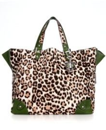 On the prowl, this diva-licious day bag from Juicy Couture puts exotic into everyday accessorizing. Posh, leopard print haircalf is outfitted with leather trim and stud accents, while the spacious interior lets you take along almost anything.