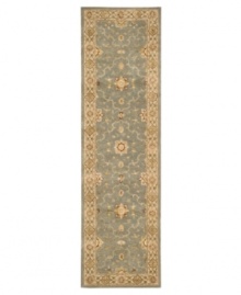 With a soft, aqua-blue center, bordered in light beige, this Nourison area rug offers a fluid color palette style for any space. Rivaling the world's finest heirloom rugs, this handcrafted piece is made with a luxuriously dense New Zealand wool pile and woven with generous portions of pure silk.