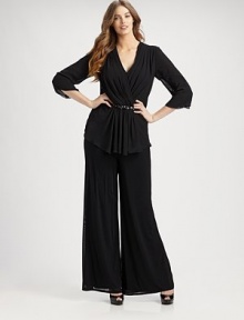 The flattering faux-wrap neckline leads to the most flawless draping ever. V-neckThree-quarter sleevesBeaded detailBack zipperAbout 36 from shoulder to hemFully linedPolyesterDry cleanImported