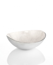 Full of surprises, this handcrafted bowl features sleek, polished aluminum with a scalloped ivory center. Keep it on display no matter what's on your menu. From the Simply Designz serveware and serving dishes collection.