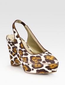 A leopard print lends fierce style to this slingback pump in rich Italian canvas, heightened by a sturdy wedge. Self-covered wedge, 4 (100mm)Covered platform, 1½ (40mm)Compares to a 2½ heel (65mm)Canvas upper with faux leather trimPoint toeElasticized slingback strapFaux leather lining and solePadded insoleMade in Italy