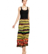 A bold global-inspired print puts this Calvin Klein maxi skirt center stage for standout summer style!