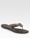 Saffiano leather thong in an exotic leopard print, topped with a goldtone designer adornment. Saffiano leather upperLeather liningRubber soleImportedOUR FIT MODEL RECOMMENDS ordering true whole size; ½ sizes should order the next whole size down. 