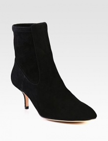 This on-trend suede ankle boot has a back stretch panel for superior comfort. Self-covered heel, 2¾ (70mm)Suede upper and stretch suede back panelPull-on styleLeather lining and solePadded insoleImportedOUR FIT MODEL RECOMMENDS ordering one half size down as this style runs large. 