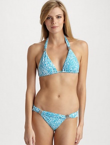 Lively abstract graphics mimic the ocean scene on this halter triangle style, with silvery bead accents.Halter straps tie at the neck Adjustable cups Back tie closure Fully lined 85% Meryl nylon/15% spandex Fully lined Hand wash ImportedPlease note: Bikini bottom sold separately. 