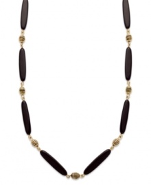 Add instant appeal to any outfit with this chic necklace from Lauren by Ralph Lauren. Featuring glass and resin onyx beads and an easy lobster claw clasp. Textured antique 14k gold plated beads provide the perfect finishing touches. Approximate length: 36 inches.