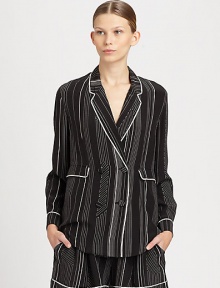 Pinstripes and a menswear-inspired fit recast the double-breasted jacket as a trend-smart silk pajama top. Notched lapelsButton frontLong sleevesFront flap pocketsAbout 26 from shoulder to hemSilkDry cleanImportedSIZE & FITModel shown is 5'10 (177cm) wearing US size 4. 